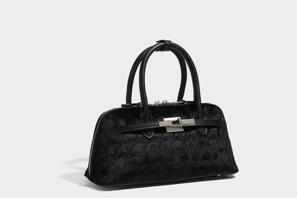 Small structured satchel bag in dark brown velvet-like textured finish with leather-look trim, silver-tone turn-lock bar