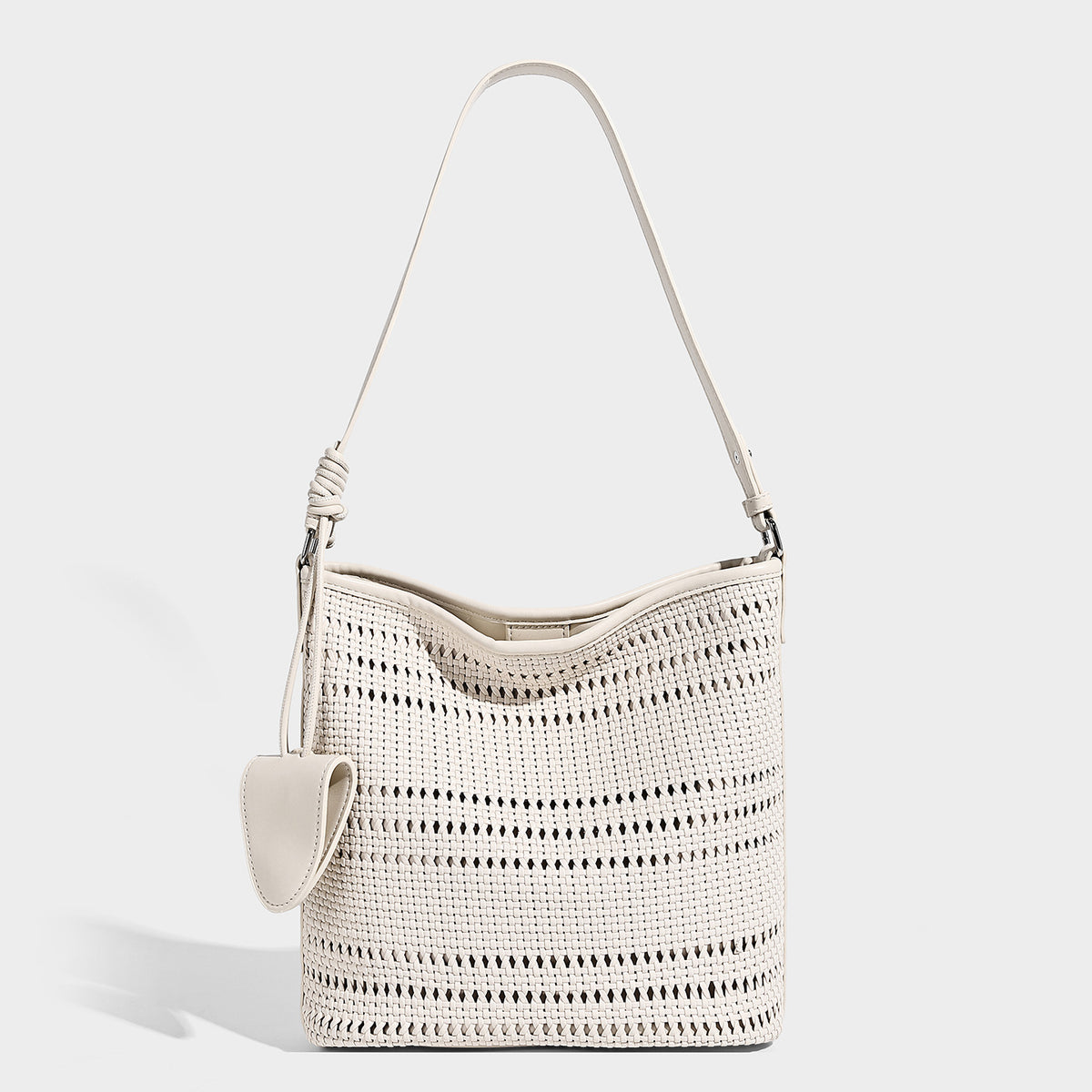 Handwoven open-weave shoulder bag with leather-look trim, knotted adjustable strap, and clip-on sunglasses sleeve pouch