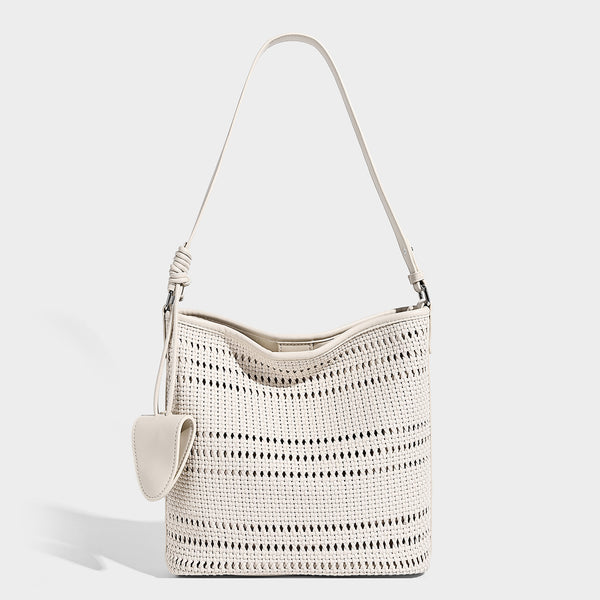 Handwoven open-weave shoulder bag with leather-look trim, knotted adjustable strap, and clip-on sunglasses sleeve pouch