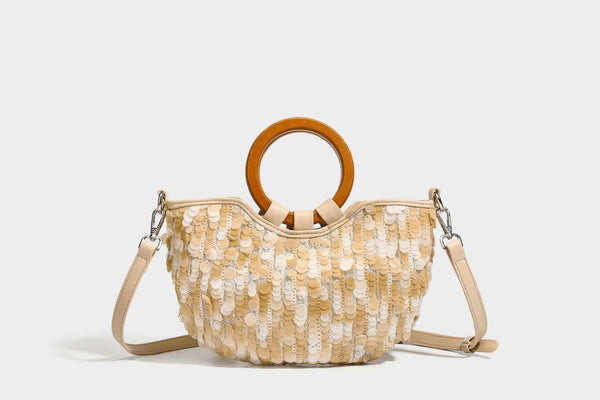 Small sequin half-moon handbag with circular wood-look ring handles and detachable leather-look shoulder strap, detail view