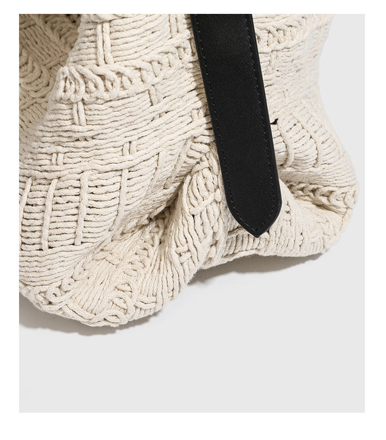 Cream woven rope-cord hobo bag with black adjustable leather-look strap and matching cream drawstring pouch, detail view 14