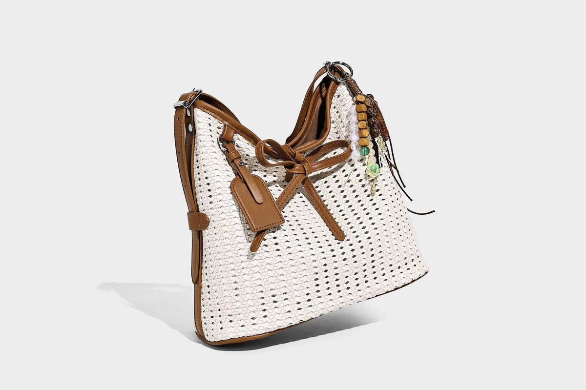 Slouchy open-weave shoulder tote bag with leather-look tan trim, tie-front closure, and long adjustable strap, detail view 10