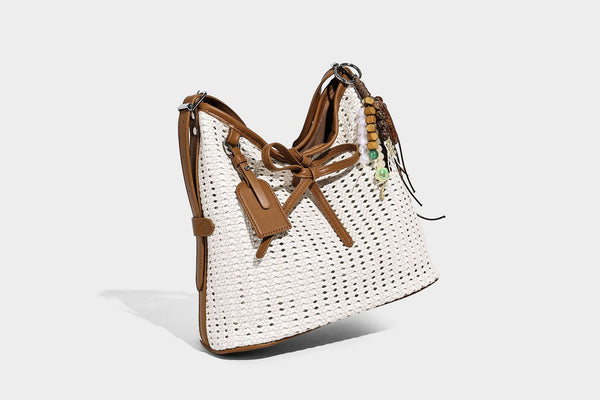 Slouchy open-weave shoulder tote bag with leather-look tan trim, tie-front closure, and long adjustable strap, detail view 10