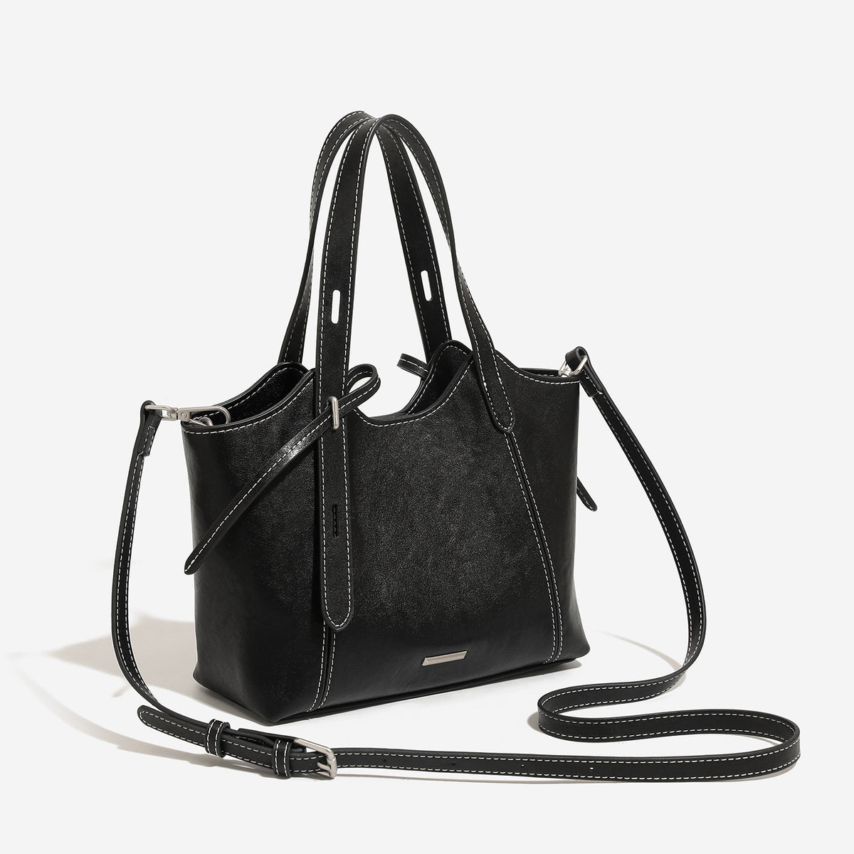 Structured distressed leather-look tote bag with contrast topstitching, side tie detail, dual top handles, and detachable