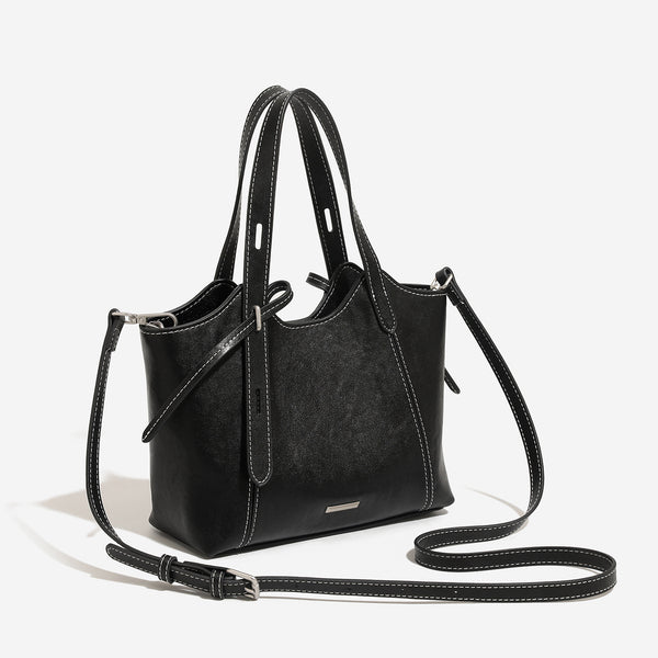 Strukturierte Tote-Bag aus Used-Lederimitat mit kontrastierenden Ziernähten, seitlichem Bindebanddetail, zwei Tragegriffen oben und abnehmbarem