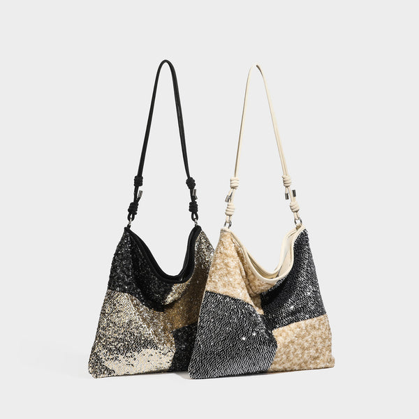 Lässig fallende Schulter-Tote mit Patchwork-Pailletten, Colorblocking-Einsätzen in Schwarz-Gold oder Creme-Silber und verstellbarem schmalem Riemen