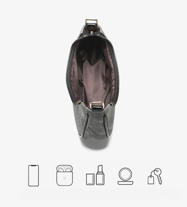 Small gray crescent half-moon shoulder bag with black leather-look trim, gold-tone zipper, and adjustable slim strap, detail