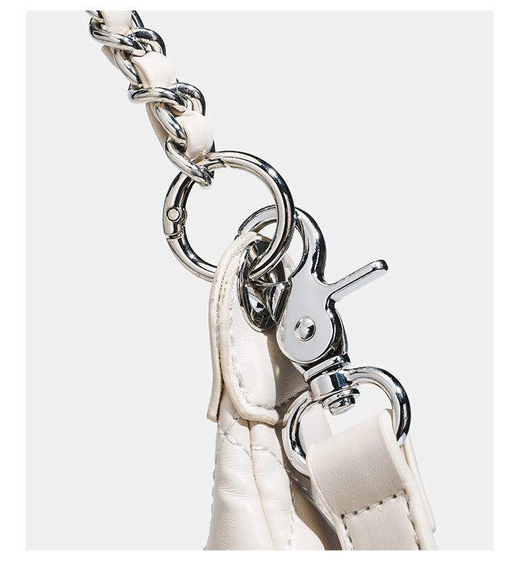 Off-white quilted leather-look hobo shoulder bag with diamond stitching, chain-and-strap handle, two front flap pockets