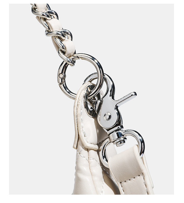 Off-white quilted leather-look hobo shoulder bag with diamond stitching, chain-and-strap handle, two front flap pockets