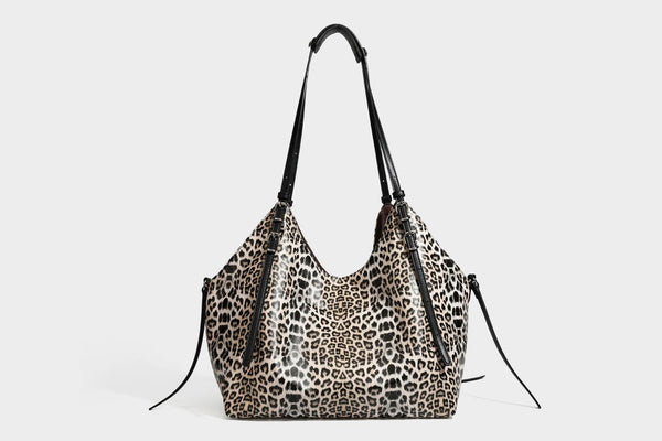 Large leopard print shoulder tote bag with glossy finish, long double straps, front zip pocket, silver-tone hardware, and