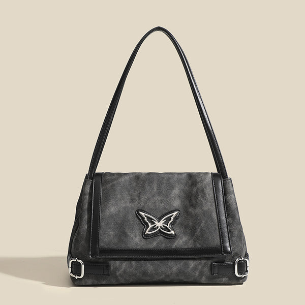 Washed leather-look shoulder tote bag with silver butterfly emblem and buckle hardware, detail view 7