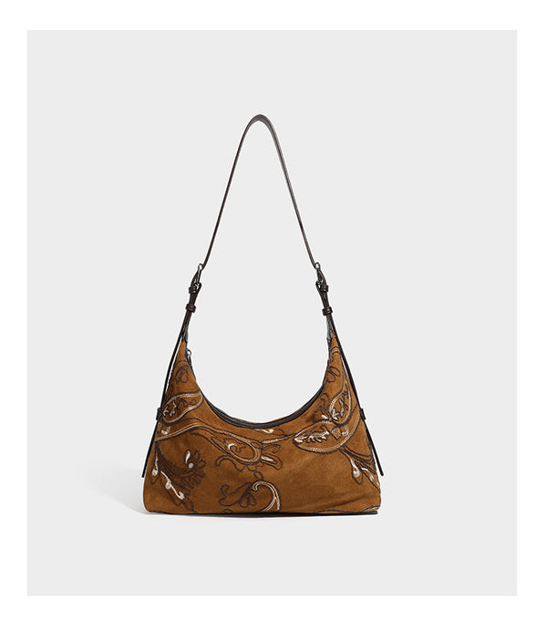 Deep chocolate suede-look hobo shoulder bag with tonal paisley floral embroidery, smooth dark leather-look trim, top zip