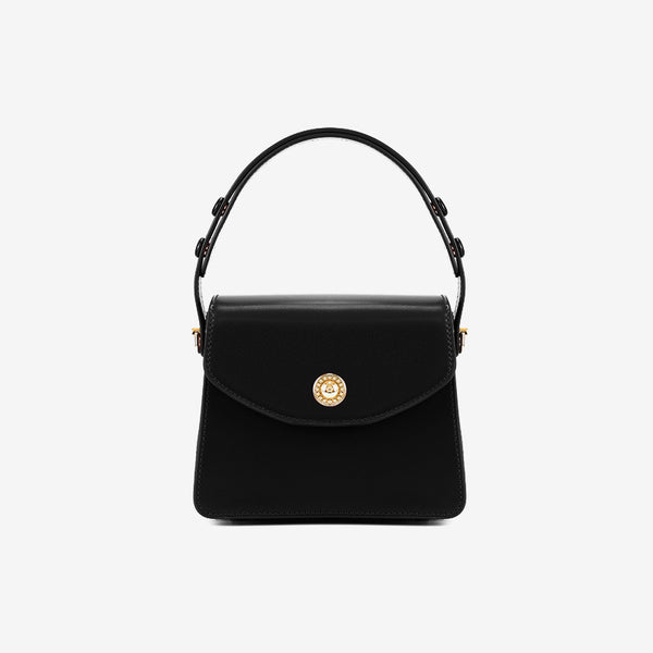 Small structured flap top-handle crossbody bag with gold-tone turn-lock clasp and detachable shoulder strap, detail view 8