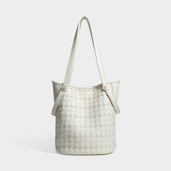 Brown embossed geometric woven leather-look bucket tote bag with dual shoulder straps, side snap hardware, and a round, front