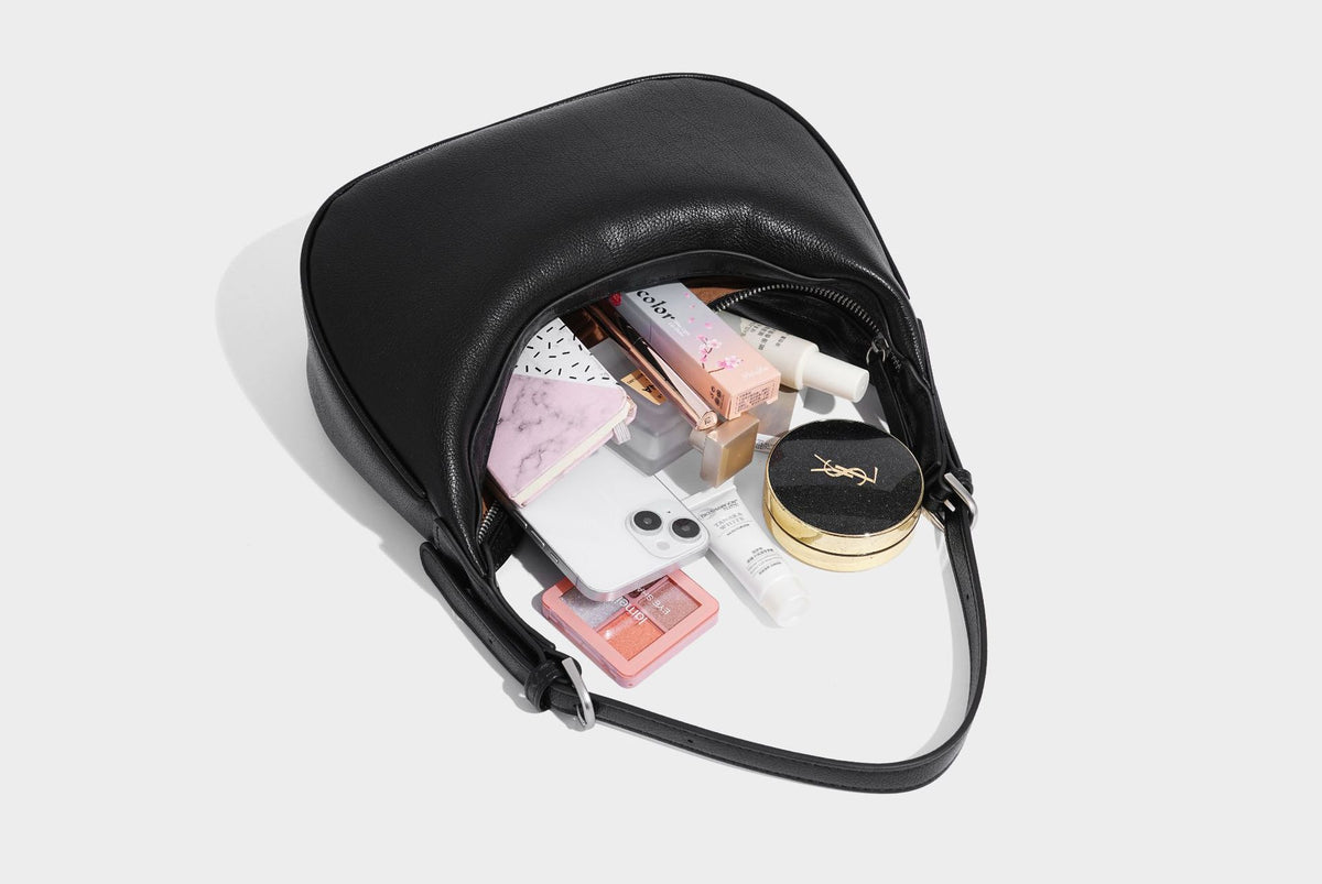 Crescent half-moon shoulder bag in pebbled leather-look finish with adjustable strap and silver-tone hardware, detail view 29
