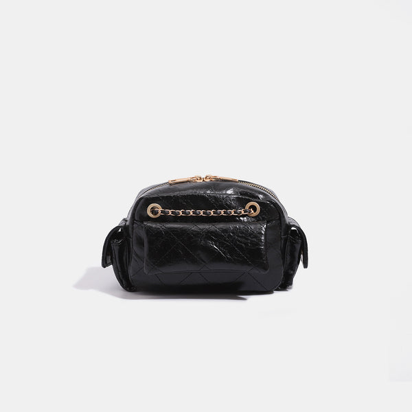 Compact quilted diamond-stitch crossbody bag with gold-tone chain strap and top zip closure, detail view 6