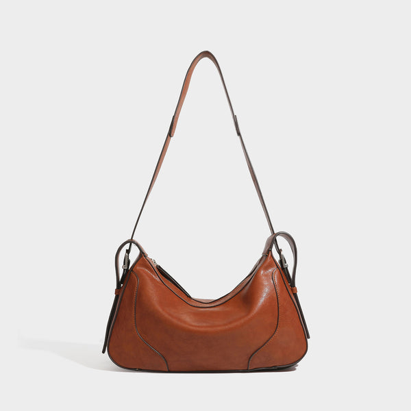 Dark brown curved zip-top hobo shoulder bag with slim adjustable strap and silver-tone hardware, front view
