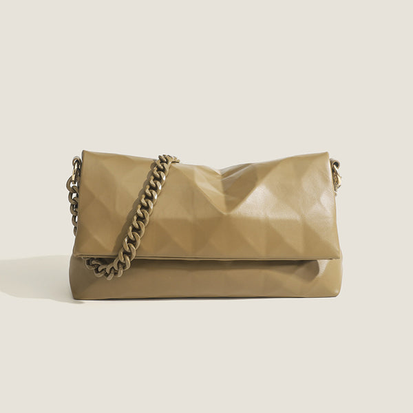 Cream white rectangular flap shoulder bag with geometric faceted surface and chunky tone-on-tone chain strap with gold-tone