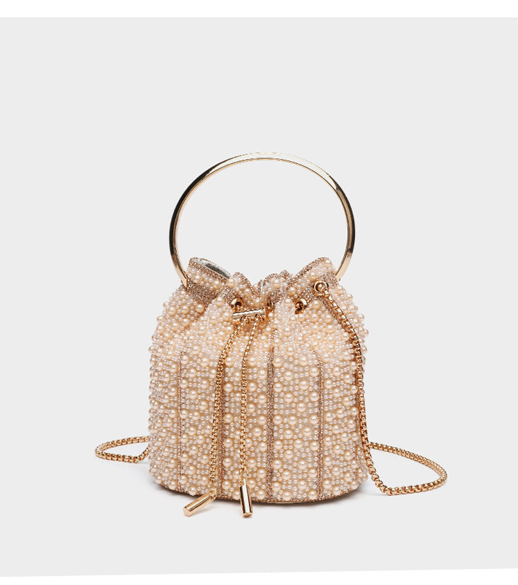 Small pearl-beaded drawstring bucket bag with silver-tone ring top handle and chain shoulder strap, detail view 18