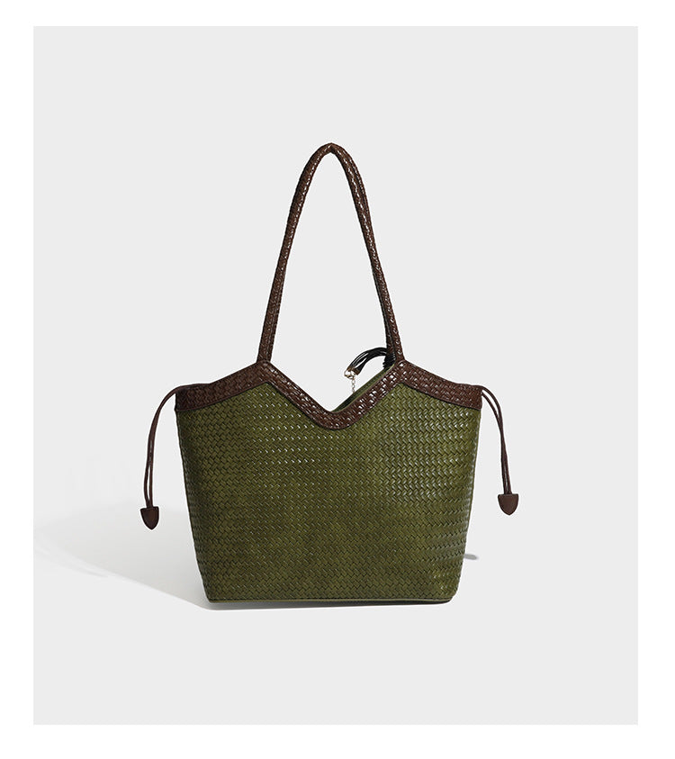 Woven tote bag with braided shoulder straps, drawstring closure, and dangling metal-and-bead charm, detail view 17