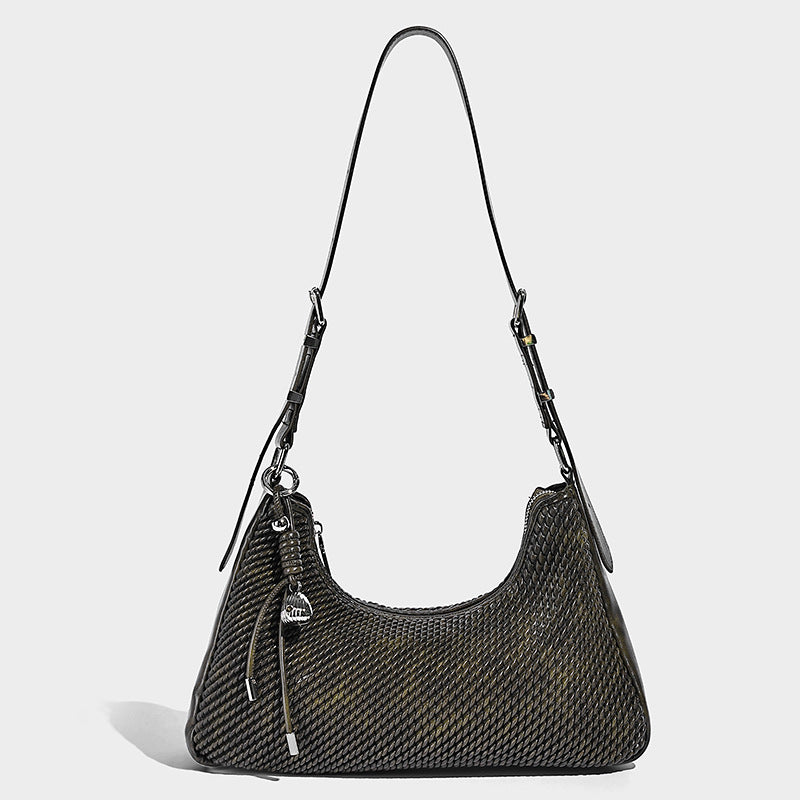 Woven crescent hobo shoulder bag with smooth side panels, zip-top closure, silver-tone charm hardware, and adjustable, detail