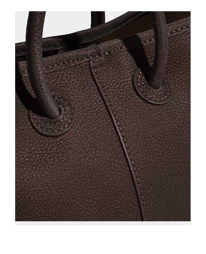 Small structured matte pebbled tote bag with twin top handles and removable zip pouch, detail view 11