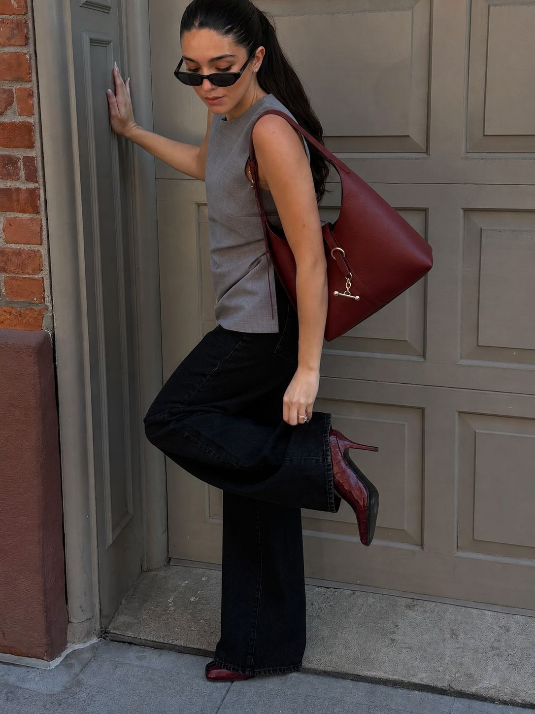 Slouchy hobo shoulder bag with gold-tone toggle ring hardware and adjustable strap, detail view 12
