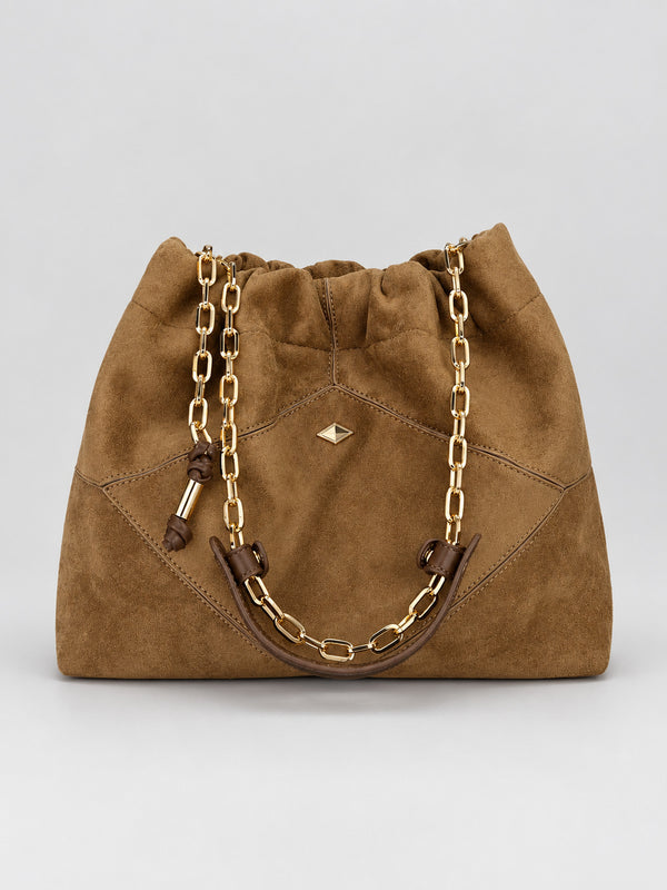Slouchy suede-look shoulder bag with gathered top, angular stitched paneling, and chunky gold-tone chain strap, detail view