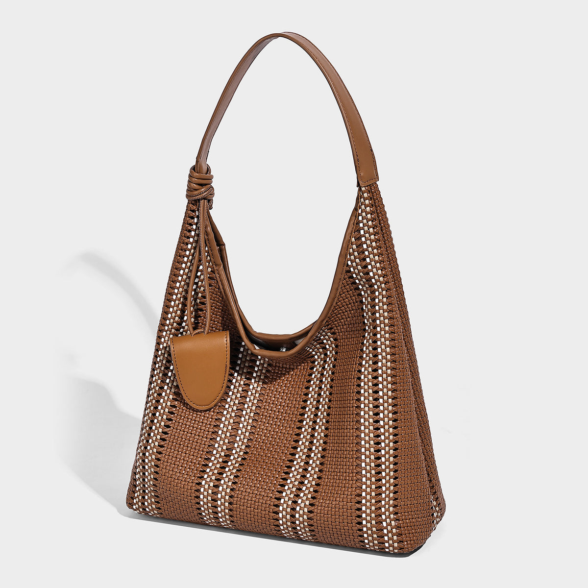 Woven striped slouch shoulder tote bag with knotted strap and attached front flap pouch, detail view 9