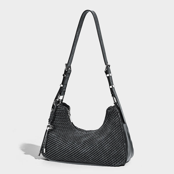 Woven crescent hobo shoulder bag with smooth side panels, zip-top closure, silver-tone charm hardware, and adjustable, detail