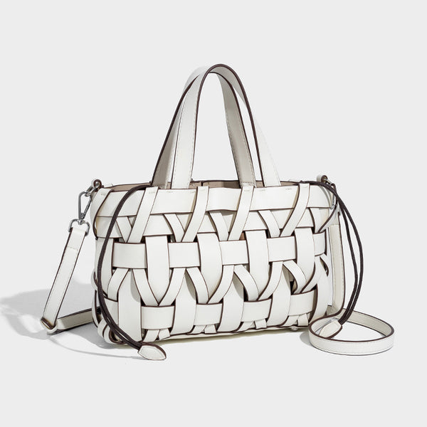 Structured woven basket tote handbag with contrasting dark trim, double top handles, detachable shoulder strap, and