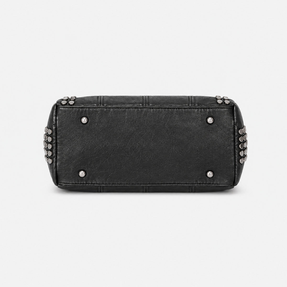 Black leather-look satchel bag with gunmetal rivet trim, grid-stitched paneling, dual rolled top handles, and curved zip