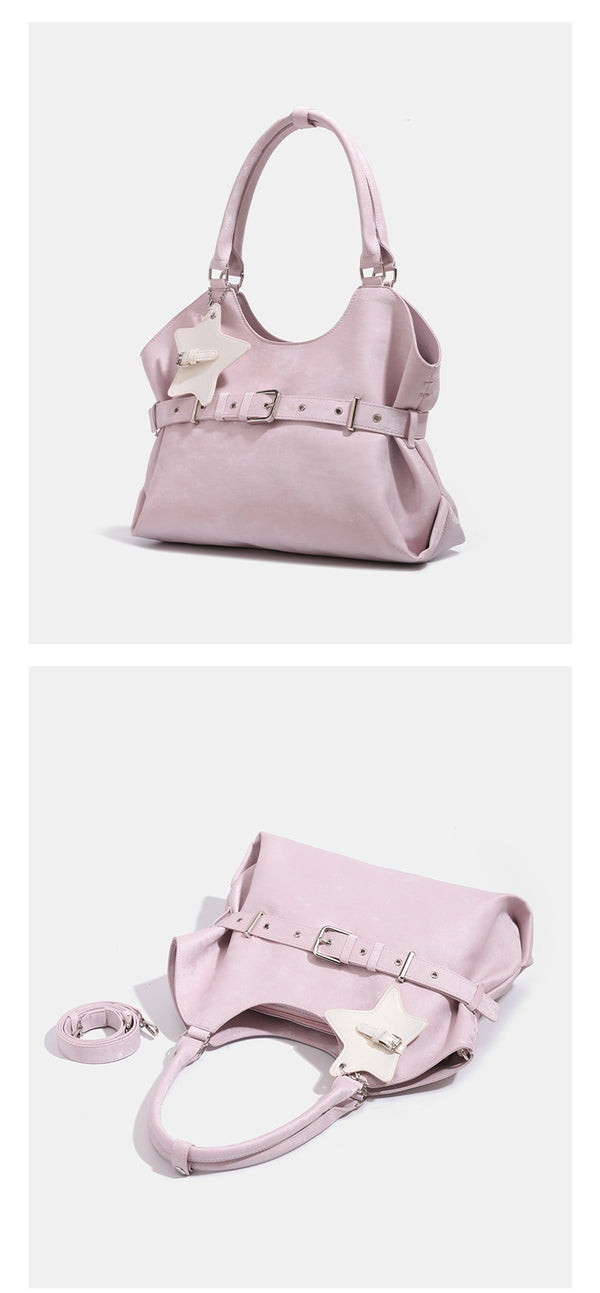 Large soft hobo shoulder bag with glossy textured finish, decorative belt buckle, star charm, and silver-tone hardware