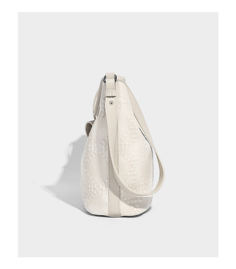 Diamond-quilted leather-look bucket shoulder bag with knotted strap accent and attached mini pouch, detail view 11