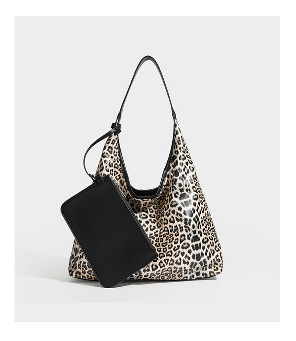 Glossy leopard-print slouchy shoulder bag with long strap and detachable tan zip pouch, detail view 15