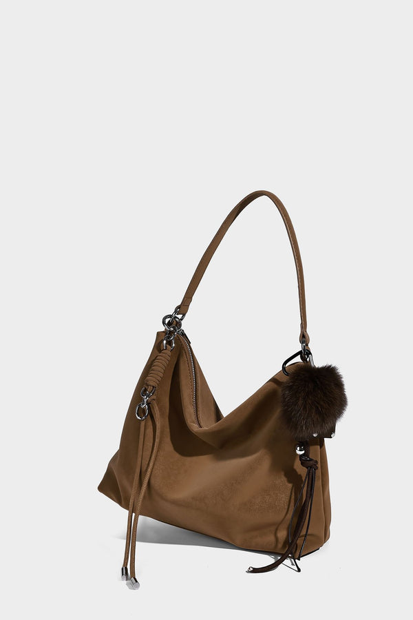Slouchy matte-finish hobo shoulder bag with tassel cords, silver-tone hardware, and faux-fur pom charm, detail view 34