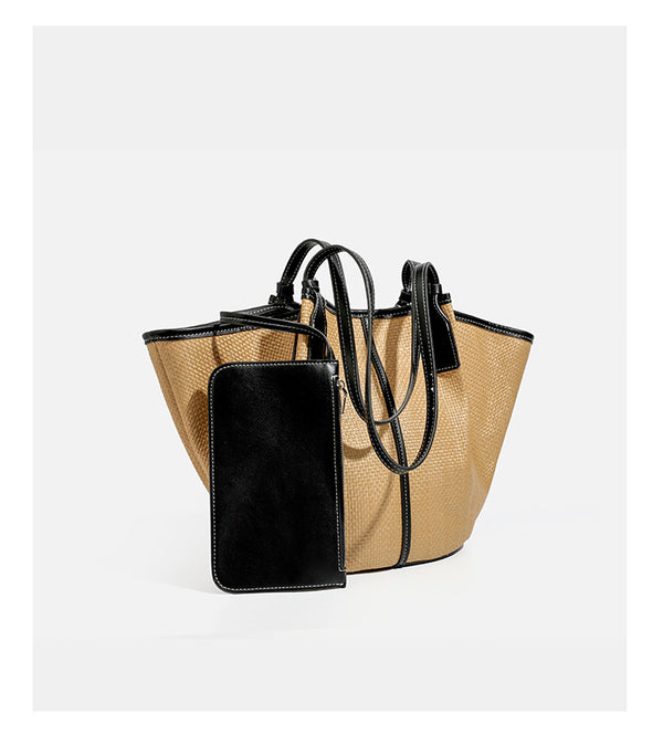 Tan woven tote bag with contrasting leather-look trim, long shoulder straps, and detachable rectangular zip pouch, detail