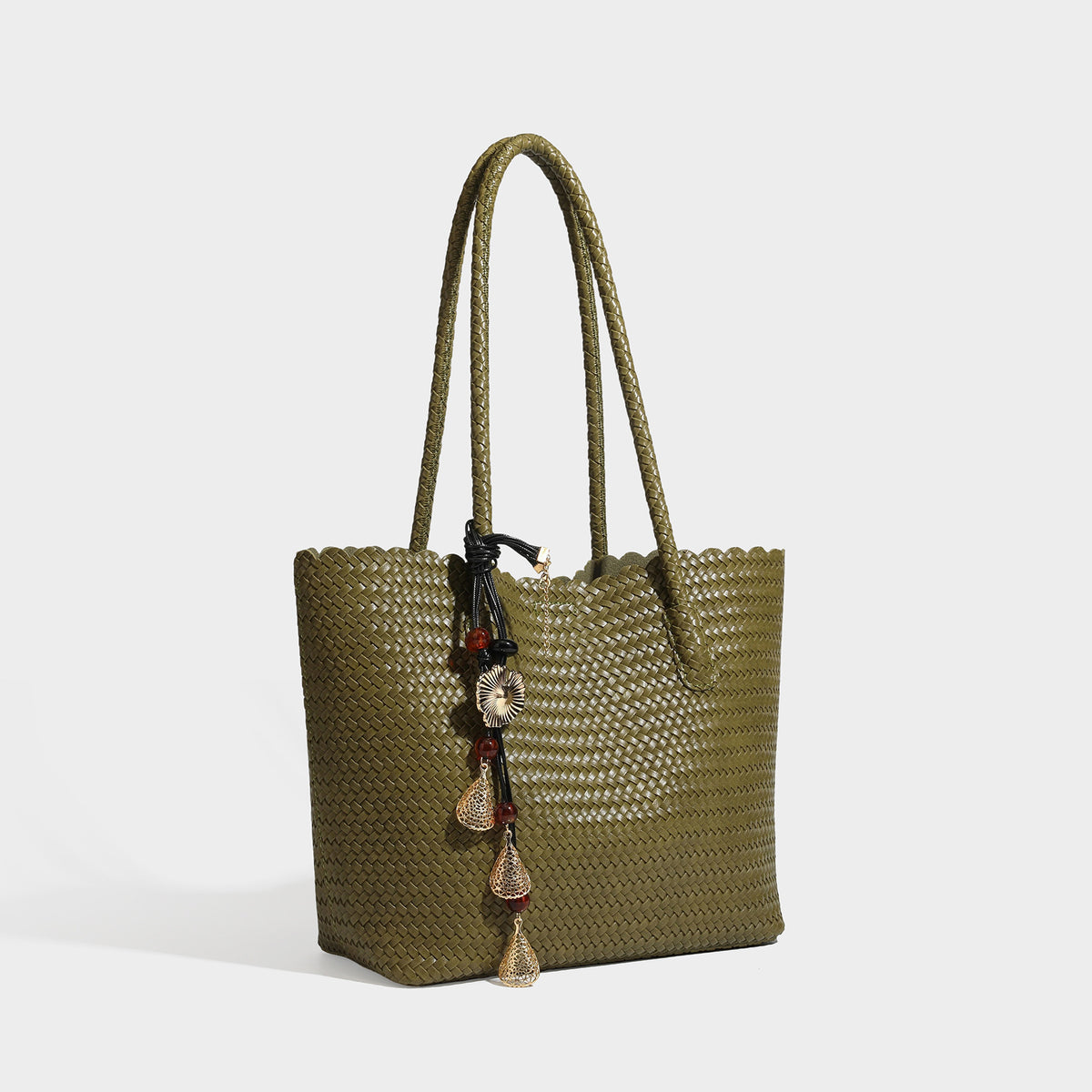 Large open-top woven leather-look tote bag in dark brown with scalloped edge, braided double shoulder straps, and decorative