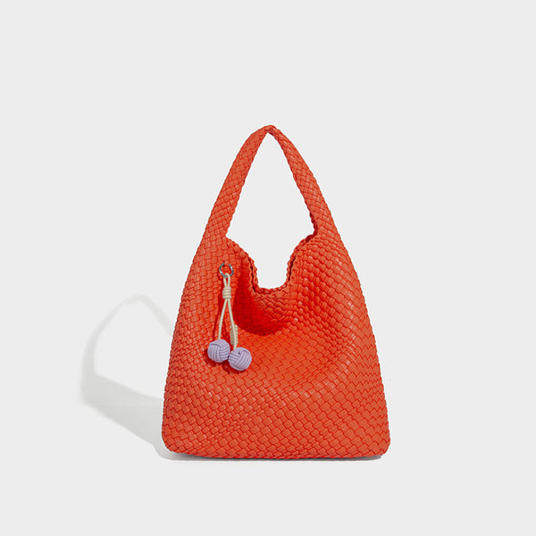 Soft hand-woven slouchy hobo tote bag with knotted tassel charm and single looped shoulder strap, detail view 21
