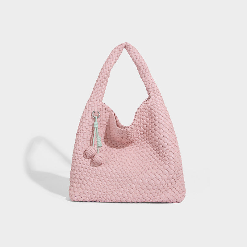 Soft hand-woven slouchy hobo tote bag with knotted tassel charm and single looped shoulder strap, detail view 8