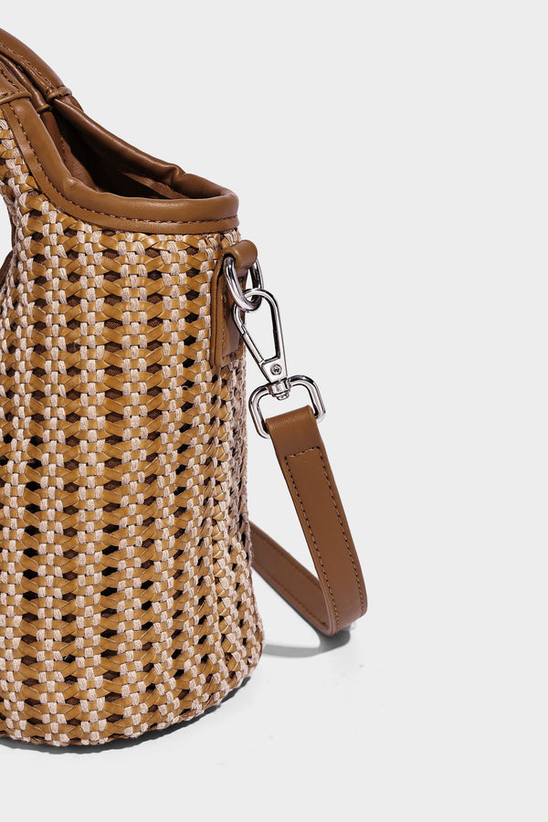 Small structured woven tote crossbody bag with ring top handle, leather-look brown trim, front patch pocket, and detachable