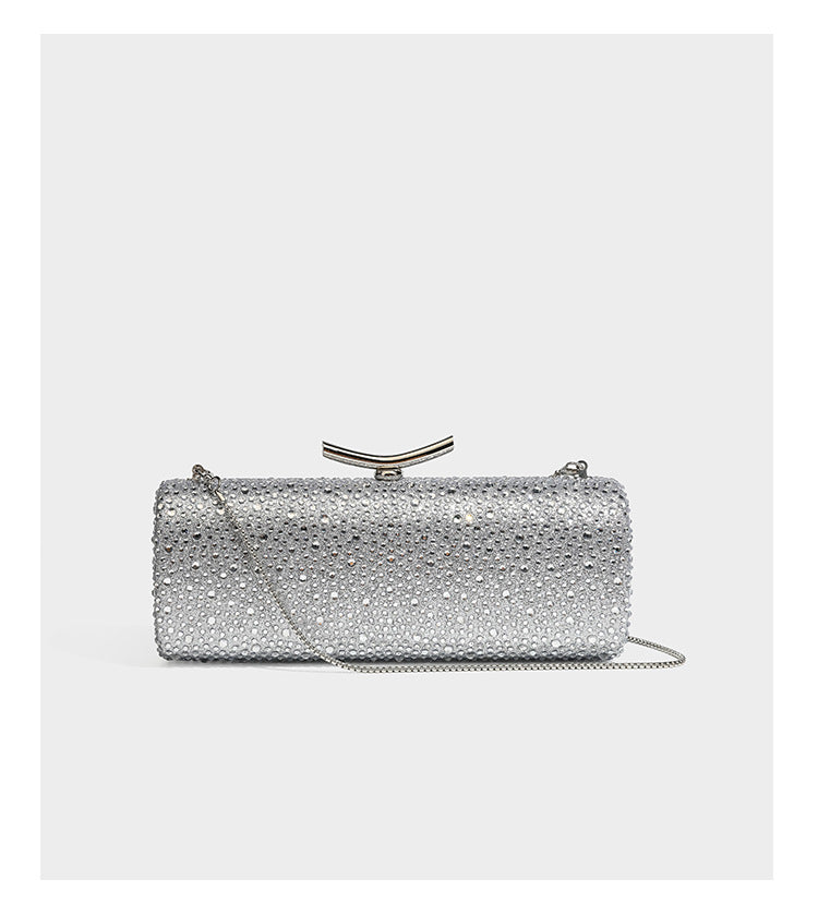 Structured rectangular hard-case clutch bag covered in all-over rhinestone crystal embellishment with curved kiss-lock top