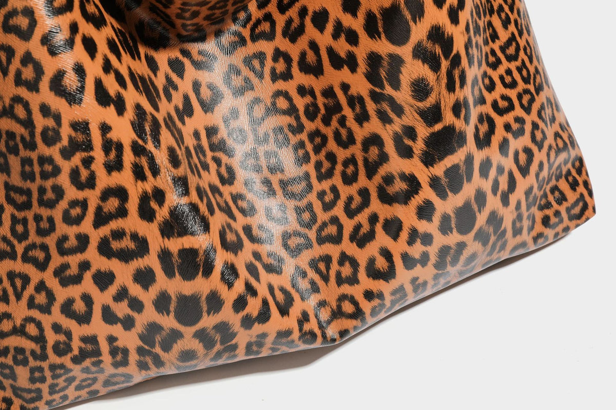 Glossy leopard-print slouchy shoulder bag with long strap and detachable tan zip pouch, detail view 28