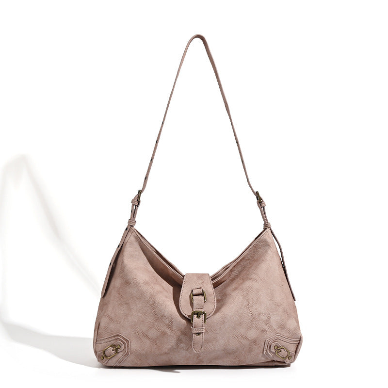 Slouchy distressed leather-look hobo bag with antique brass buckle closure and adjustable shoulder strap, detail view 5