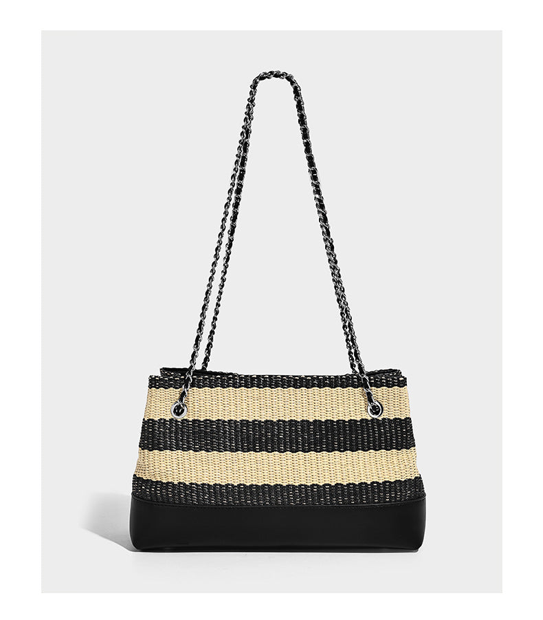 Structured black and beige striped woven shoulder bag with silver chain strap and turn-lock metal clasp, detail view 9