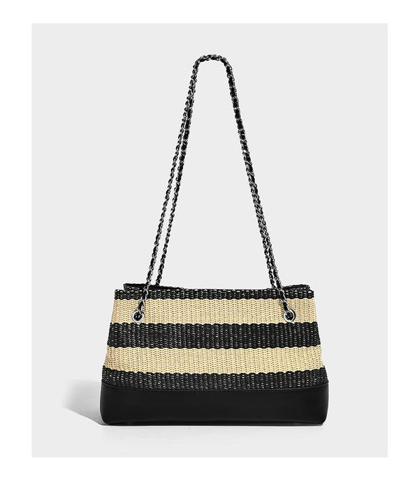 Structured black and beige striped woven shoulder bag with silver chain strap and turn-lock metal clasp, detail view 9