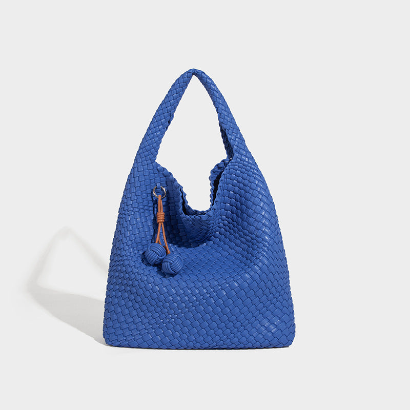 Soft hand-woven slouchy hobo tote bag with knotted tassel charm and single looped shoulder strap, detail view 18