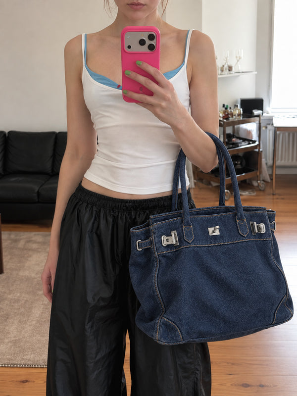 Large structured tote bag with turn-lock closure, silver-tone buckle hardware, and twin rolled handles, detail view 14