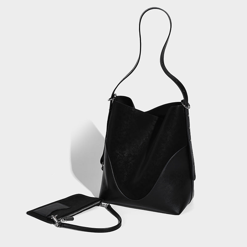 Tall matte suede-touch bucket bag with leather-look band, silver-tone hardware, and detachable zip pouch, front view