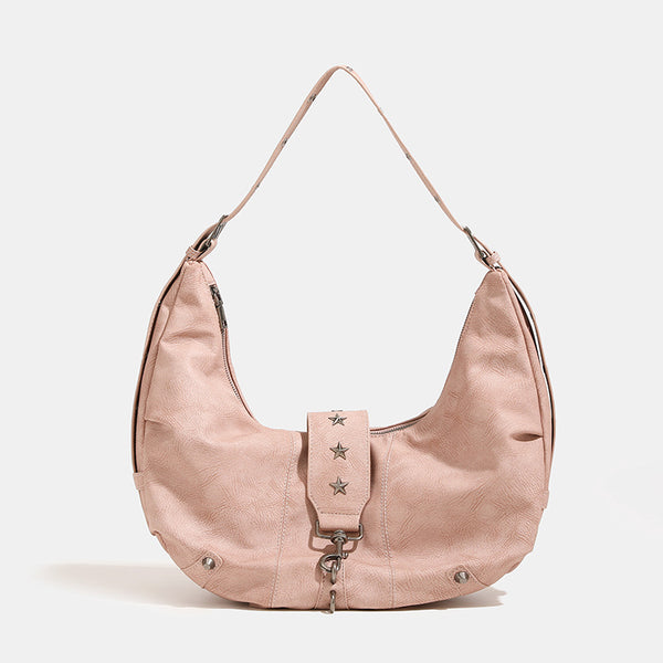 Crescent hobo shoulder bag in matte leather-look finish with star stud front panel, antique-silver hook hardware, and, detail